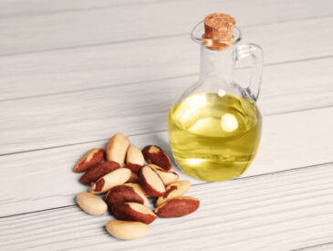 brazil nuts with bottle of oil