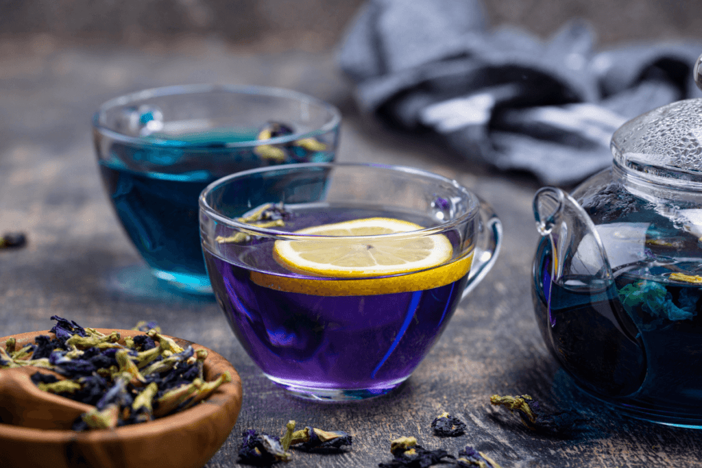 Two mugs of brewed blue butterfly pea tea