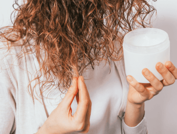 applying pre poo treatment to natural hair