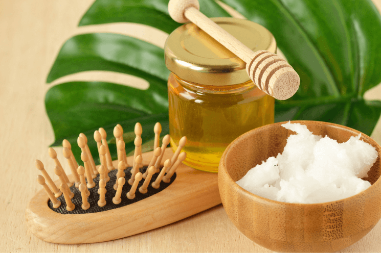 wooden brush, honey and coconut oil for frizzy hair treatment