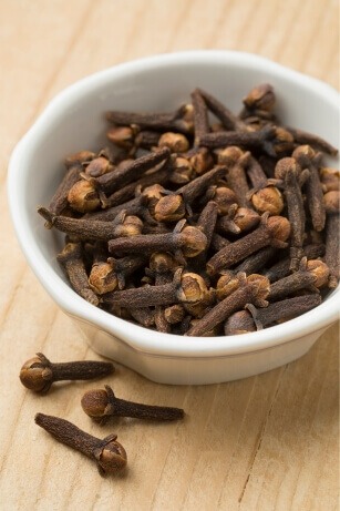 bowl of whole cloves to add to rice water recipe