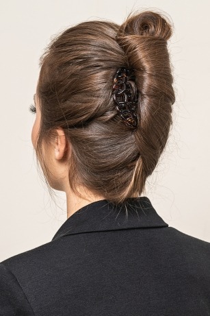 elegant hairstyle with french twist and hair clip