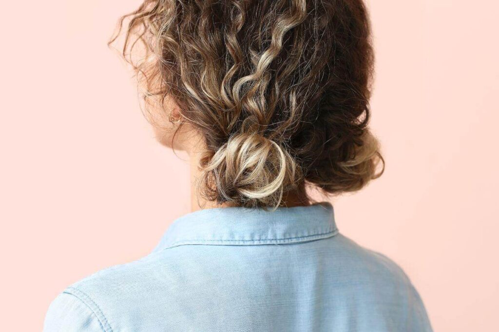 curly hairstyle with two small buns